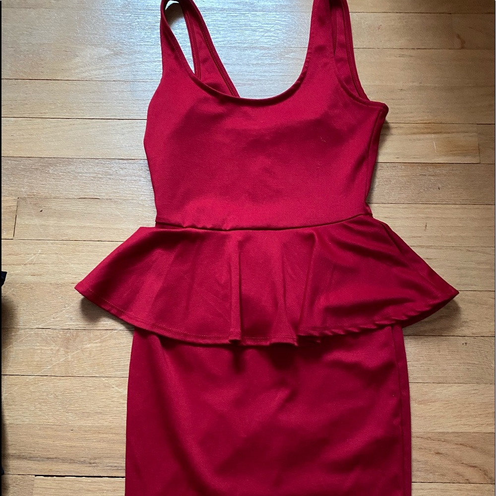 Red tank top dress with ruffle around the waste.